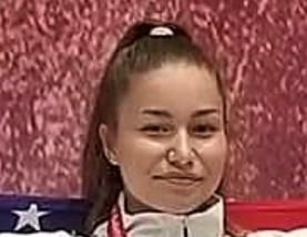 Athlete smiling with a red background