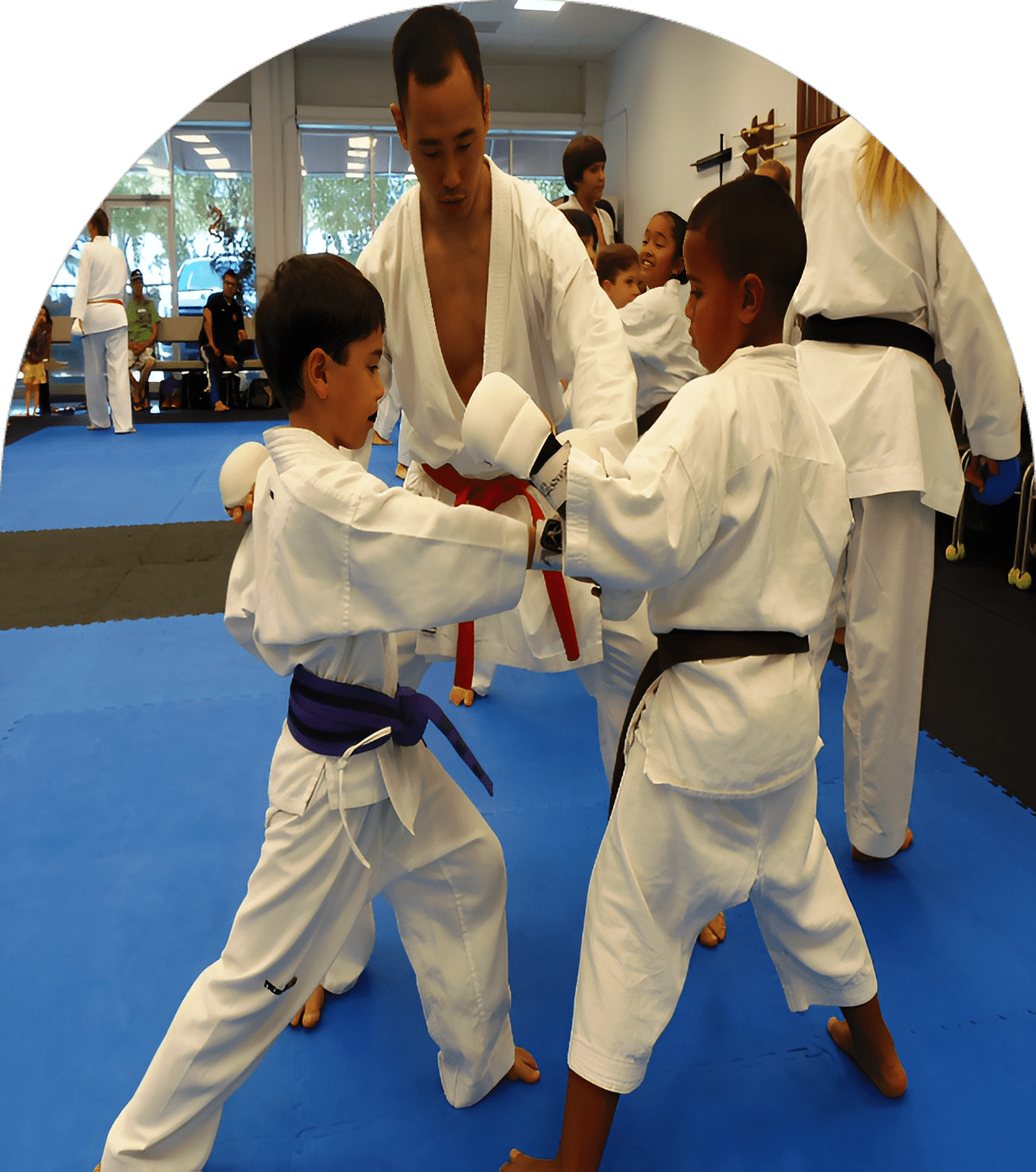 Kids practicing karate with instructor