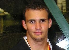 Person standing near a window