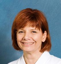 Portrait of woman with short red hair