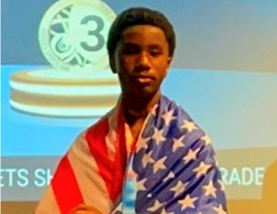 Young individual with flag backdrop