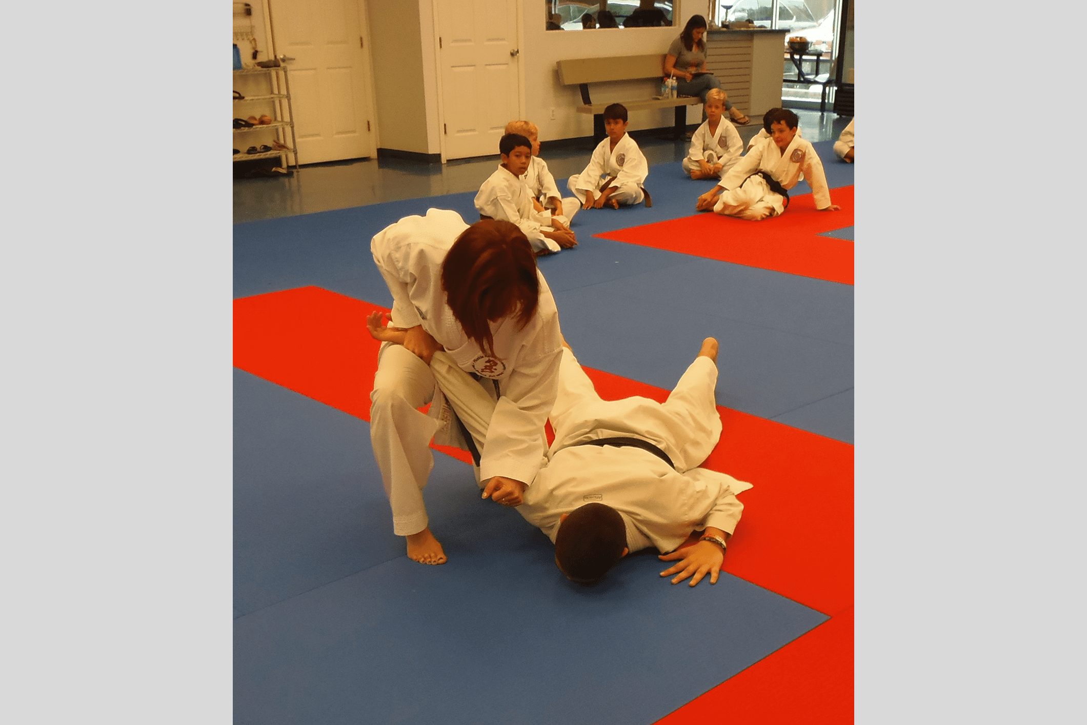 Instructor demonstrating a martial arts move.