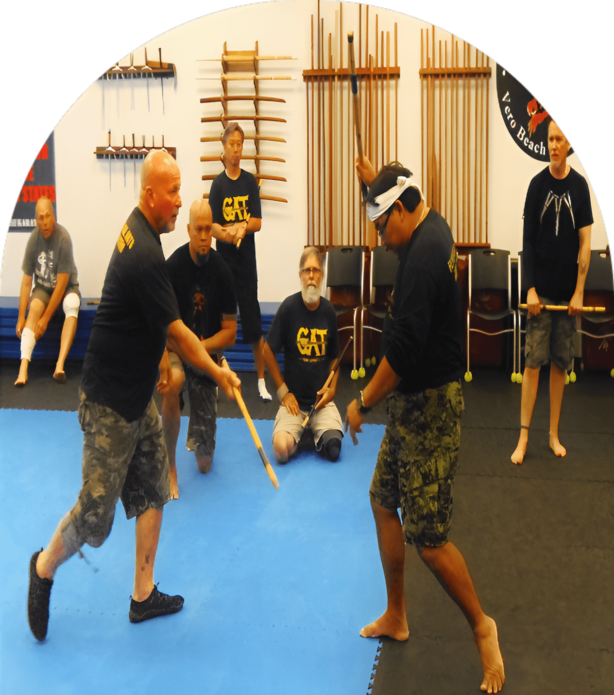 Stick fighting lesson in progress