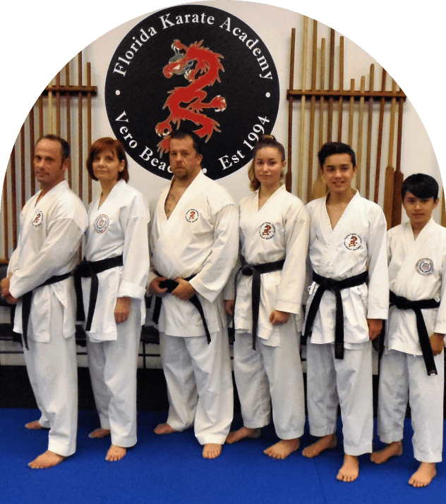 Martial artists posing in dojo