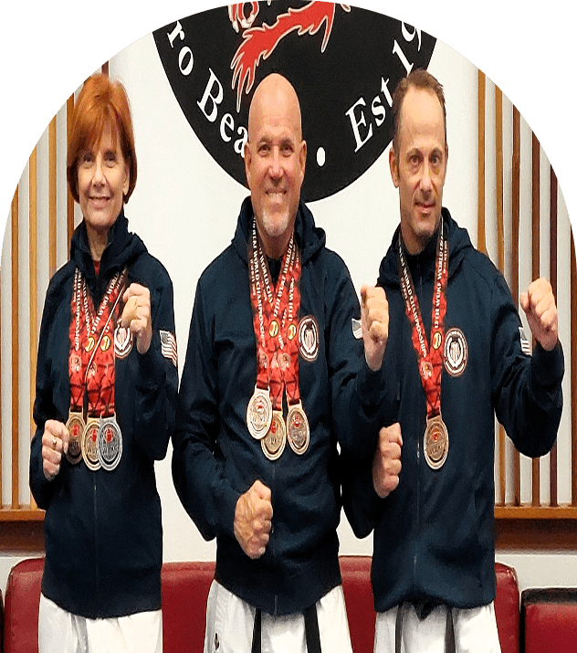 Martial artists proudly displaying medals